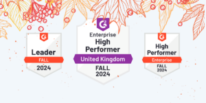 G2 Fall Badges 2024 3 badges are presented on a fall coloured leaf background. These badges contain: the high performer enterprise (specifically in the UK region), the leader for fall 2024 and the high performer for enterprise